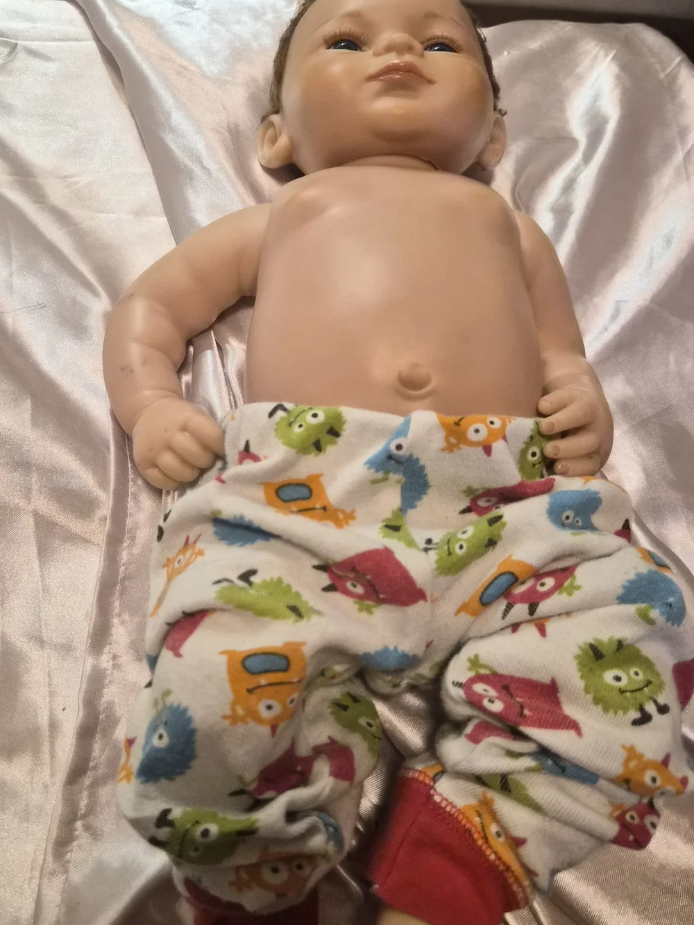 Reborn Baby Doll with Blue Eyes and Colorful Monster Pants